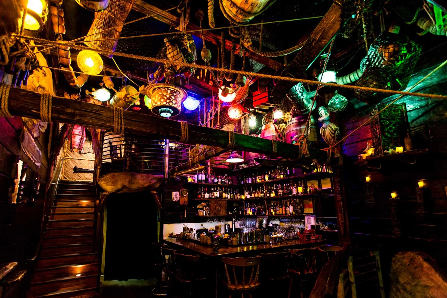 Inside Smuggler’s Cove—pirate-ship-meets-tropical interior