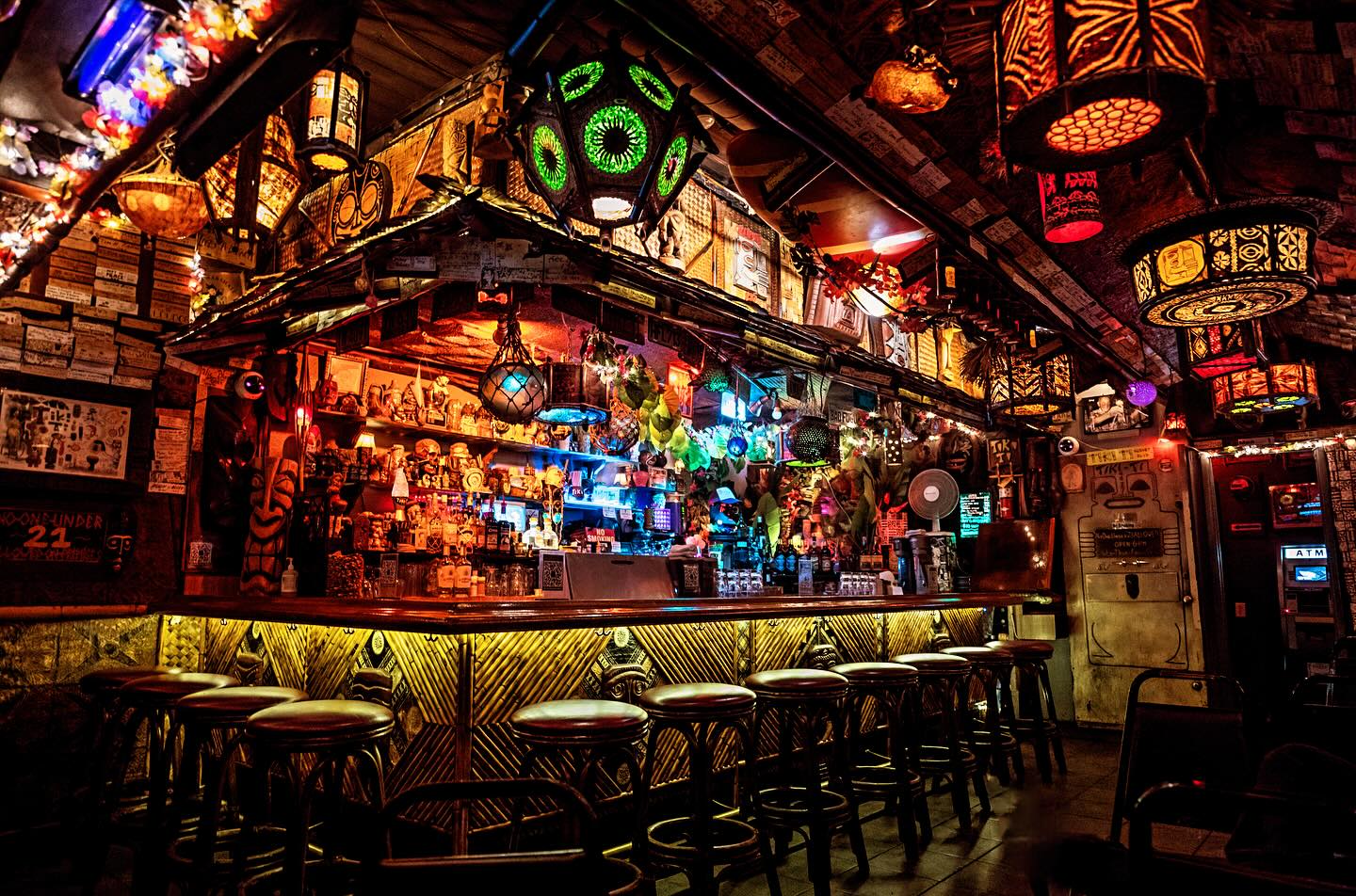 Inside Tiki-Ti—the narrow L-shaped Sunset Boulevard bar with dense tiki carvings